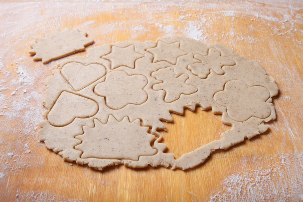 Dough for gingerbread cookie and cookie cutted in different shap - Photo, Image