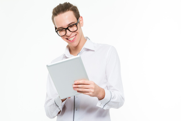 Smiling businessman using tablet computer - Фото, изображение
