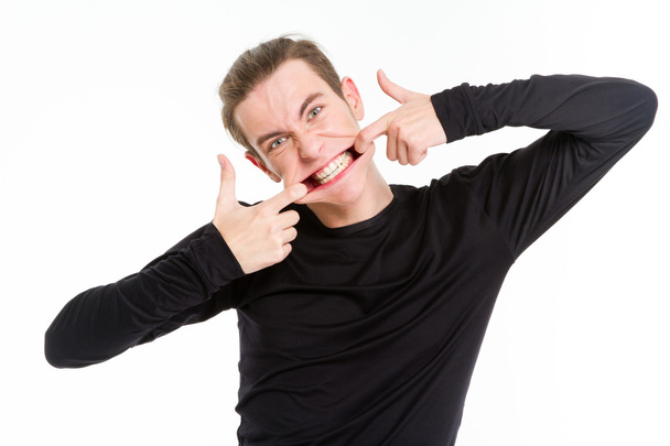 Man stretching his mouth - Foto, imagen