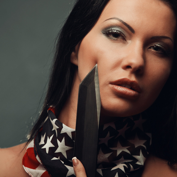 portrait of sexy topless girl with weapon and american flag - Foto, immagini