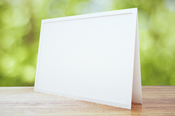 Blank white postcard on wooden table outdoor, mock up - Foto, imagen