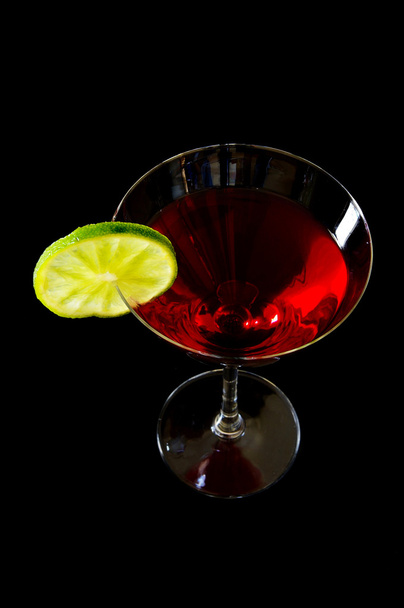 Martini glass with a twist of lime on dark background - Fotoğraf, Görsel