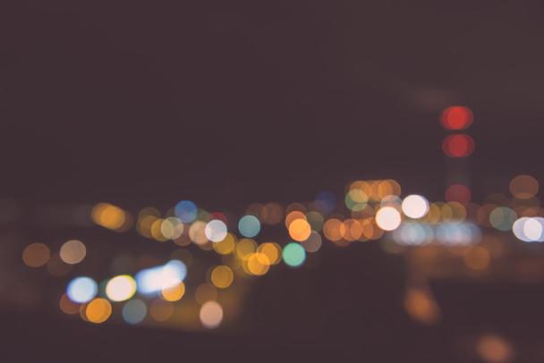 Blurred night lights in city - vintage effect - Foto, imagen