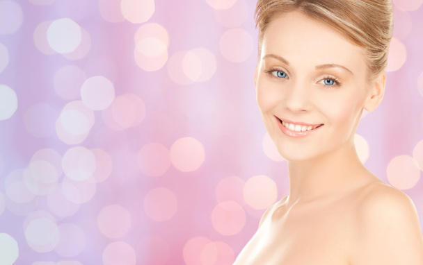 lovely woman face over pink lights background - Φωτογραφία, εικόνα