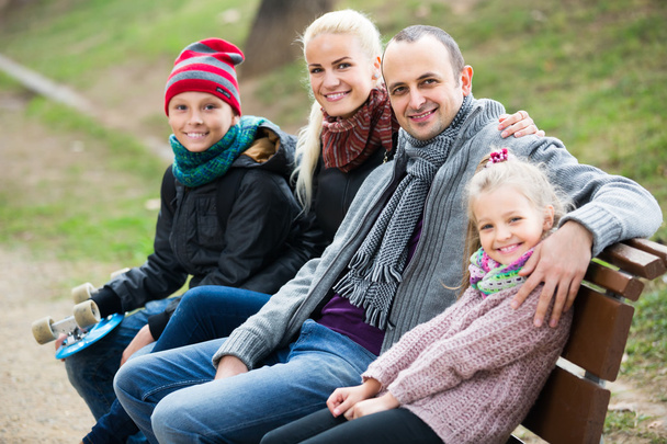 Spouses with children posing in autumn park  - Photo, Image