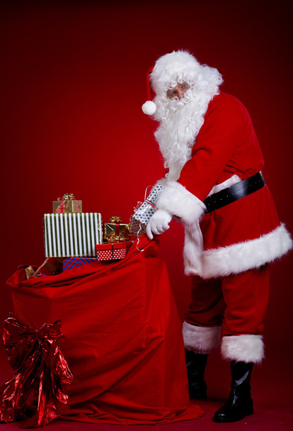 Santa Claus with a bag of gifts - 写真・画像