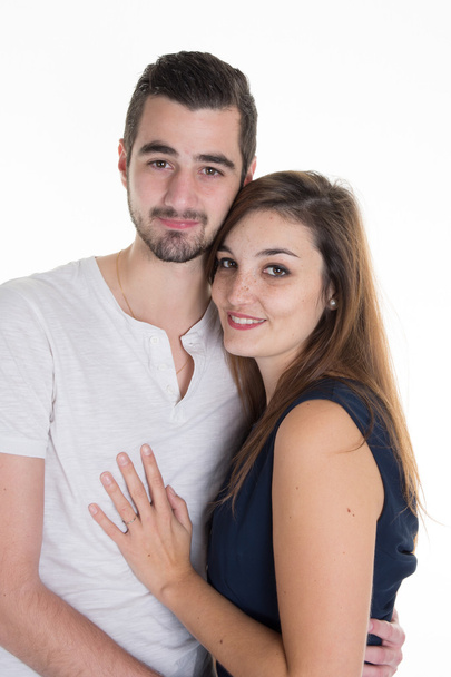 όμορφη νέος ευτυχισμένο ζευγάρι αγάπη χαμογελώντας αγκαλιάζουν, άνδρας και γυναίκα χαμόγελο κοιτάζοντας την κάμερα, απομονωθεί σε λευκό φόντο - Φωτογραφία, εικόνα