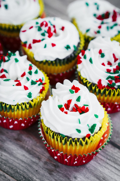Christmas cupcakes on wooden background - Фото, изображение