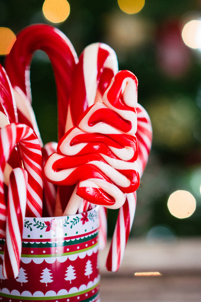 Christmas candy canes on wooden background - Photo, Image
