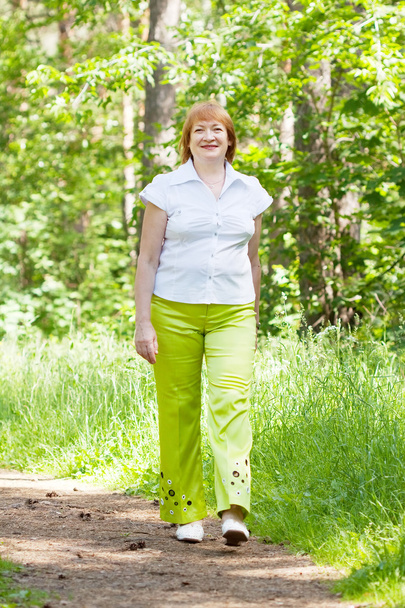 woman walking in forest - Photo, image