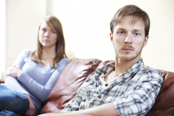Couple With Relationship Difficulties Sitting On Sofa - Foto, Imagen