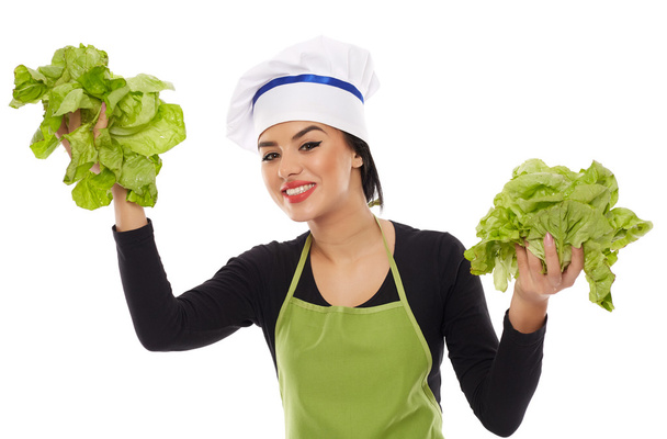 Woman cook holding lettuce - 写真・画像