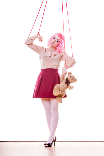 woman girl stylized like marionette puppet on string - Foto, imagen