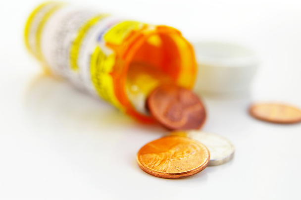 Pill bottle with coins - Photo, image