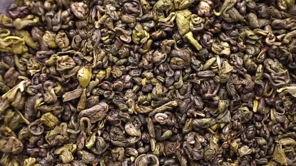 Zöld tea levelek közelről forgás - Felvétel, videó