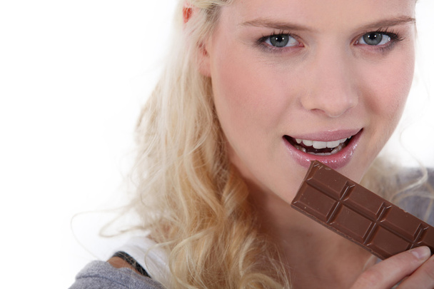 Girl eating chocolate - Foto, Imagen