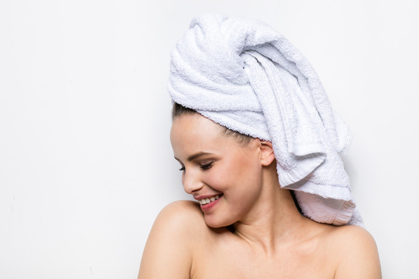 beautiful young woman with bath towel on head - Photo, Image