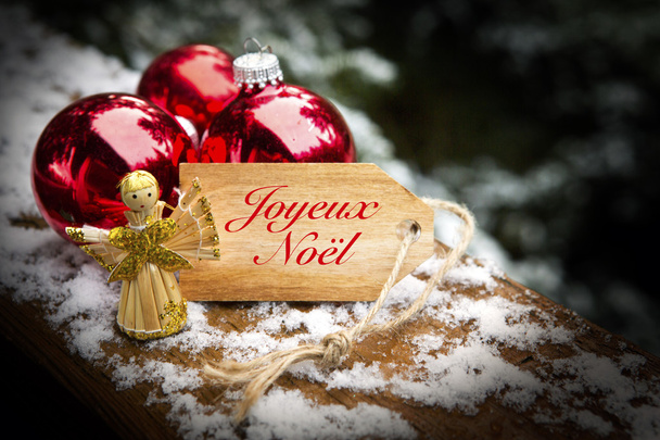francês 'Joyeux Noel' (Feliz Natal) com bolas de Natal e
  - Foto, Imagem