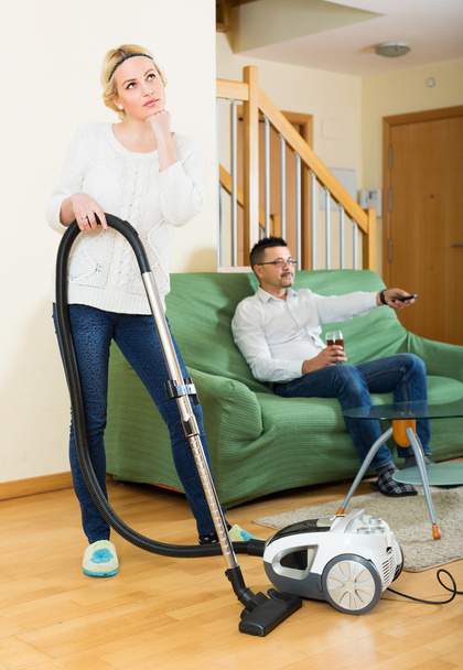 Upset woman with hoover - Photo, image