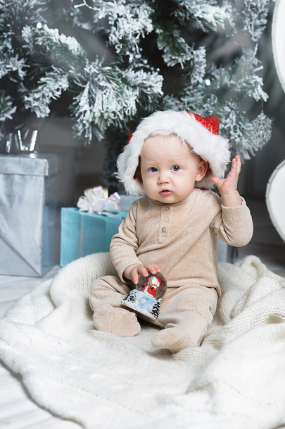 photo of cute baby in Santa hat - Фото, зображення