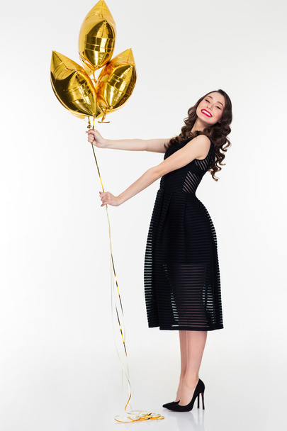Amusing positive lovely female posing with star shaped balloons - Fotó, kép