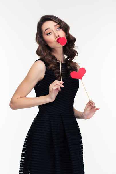 Amusing charming woman posing with paper heart and lips booth  - Foto, Imagem