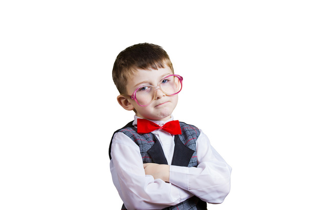 Confident little boy nerd isolated over yellow background. - Photo, Image