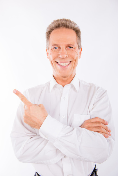 A senior man  in white shirt with beaming smile. - Fotografie, Obrázek
