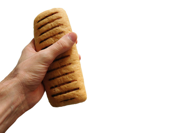 hand with bread on white background - Photo, Image