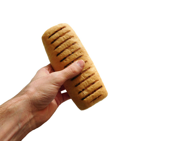 bread with hand on white background - Photo, Image
