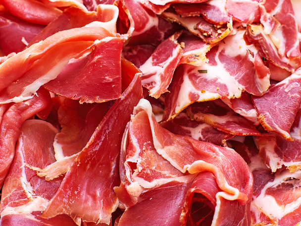 Jamon. Many dry-cured ham from Spain. - Foto, afbeelding