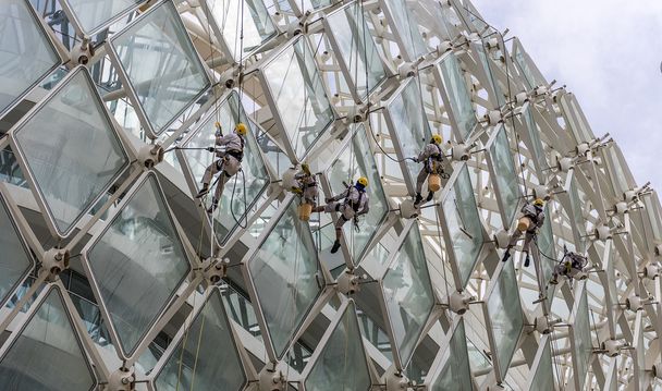 Window Cleaners hanging in the air - Photo, Image