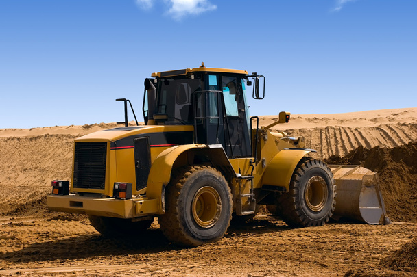 Yellow Bulldozer at Construction irrigation canal in Desert - Photo, Image