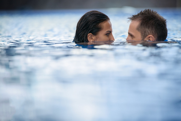 Couple in the pool - Фото, зображення