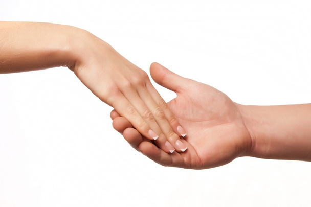 Hand in hand on white background - Photo, Image