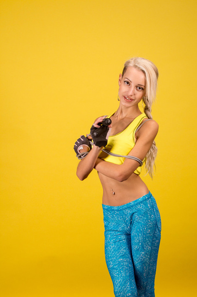 Portrait of young and healthy blonde with skipping rope - Foto, imagen
