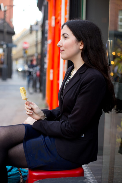 young woman eating an ice cream - Valokuva, kuva