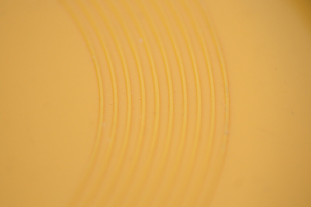gelbe Parallellinien im Kreis - Foto, Bild