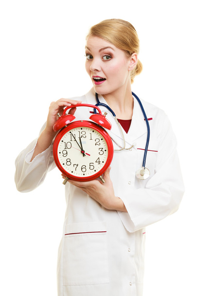 Woman doctor with clock isolated on white - Foto, Imagem