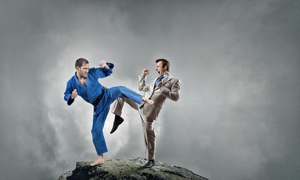 Karate man in blue kimino - Foto, Imagen