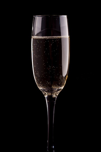 A glass of champagne on black background - Fotografie, Obrázek