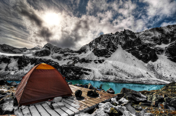 Campsite above turquoise mountain lake - Photo, Image