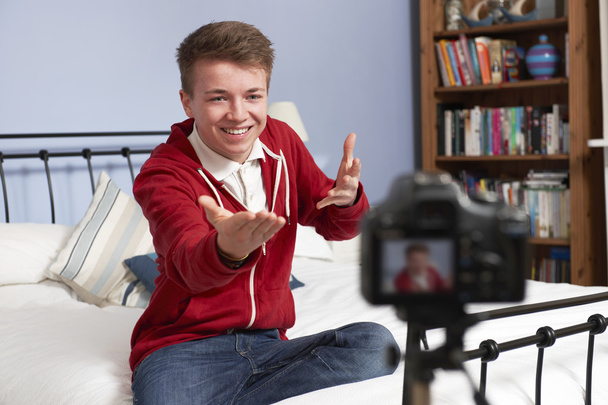 Teenage Boy Recording Video Of Himself In Bedroom - Fotó, kép