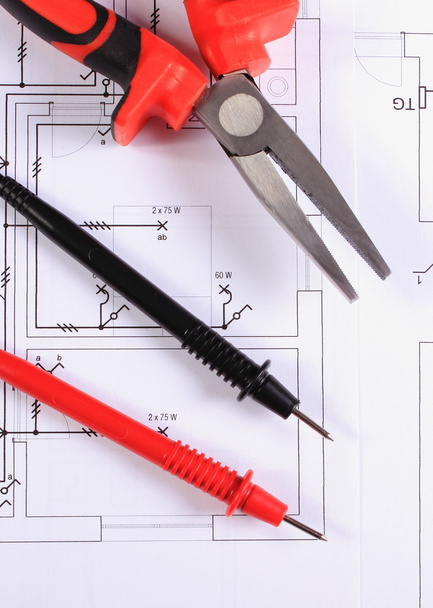 Cables of multimeter and work tool on construction drawing - Photo, Image