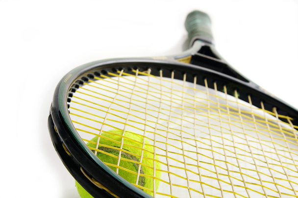 Closeup of a tennis ball and racket - Foto, afbeelding