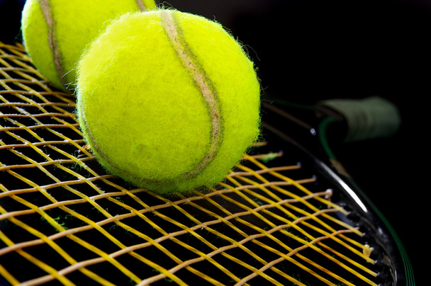Tennis balls on a racket - Zdjęcie, obraz