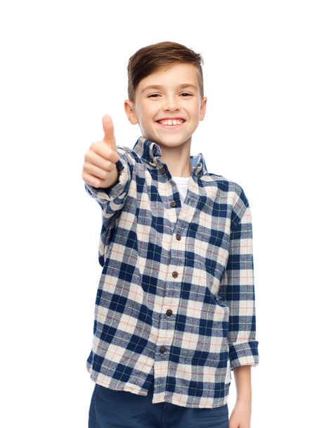 smiling boy in checkered shirt showing thumbs up - Fotó, kép