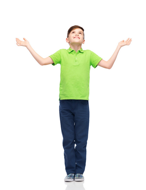 happy boy in polo t-shirt raising hands up - Фото, зображення
