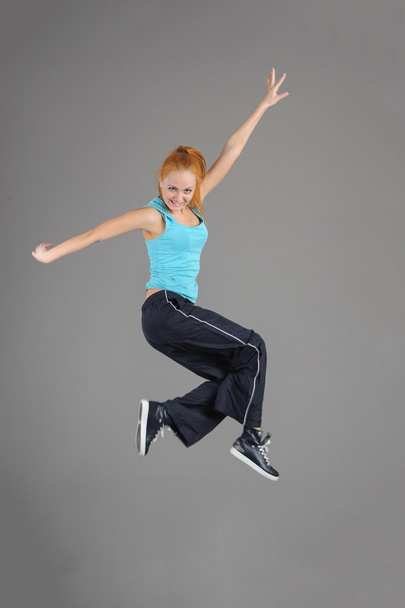Young jumping woman - Фото, зображення