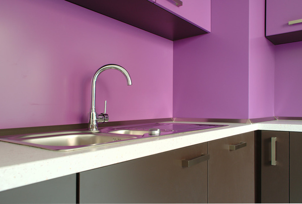 Newly fitted modern kitchen in purple and brown - Fotoğraf, Görsel